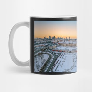 Warsaw Royal Castle, snow-covered roofs and and distant city center at dusk Mug